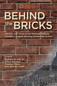 Book Cover of Behind the Bricks